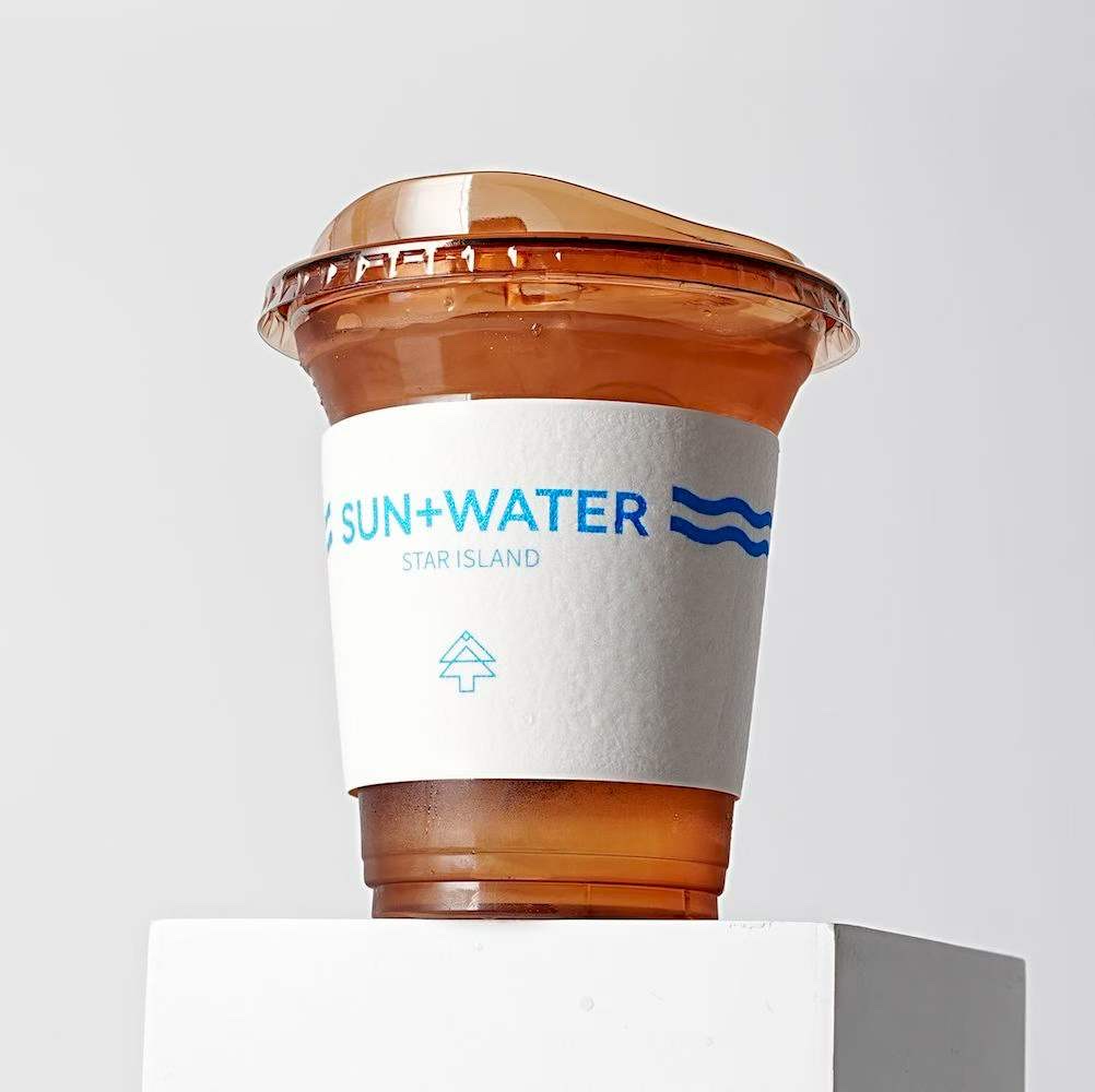 Colourful printed paper cup sleeves arranged on a light background