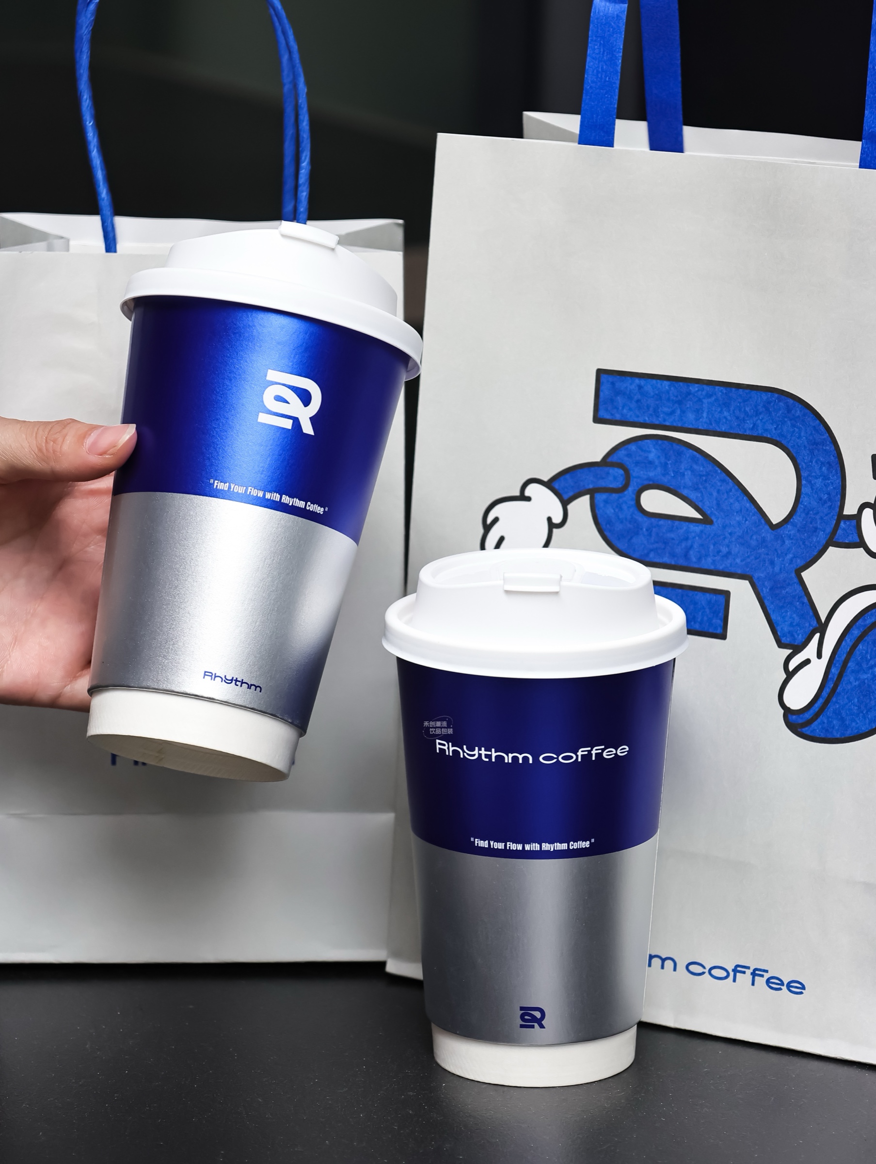 Printed paper cups shown with fitted lids